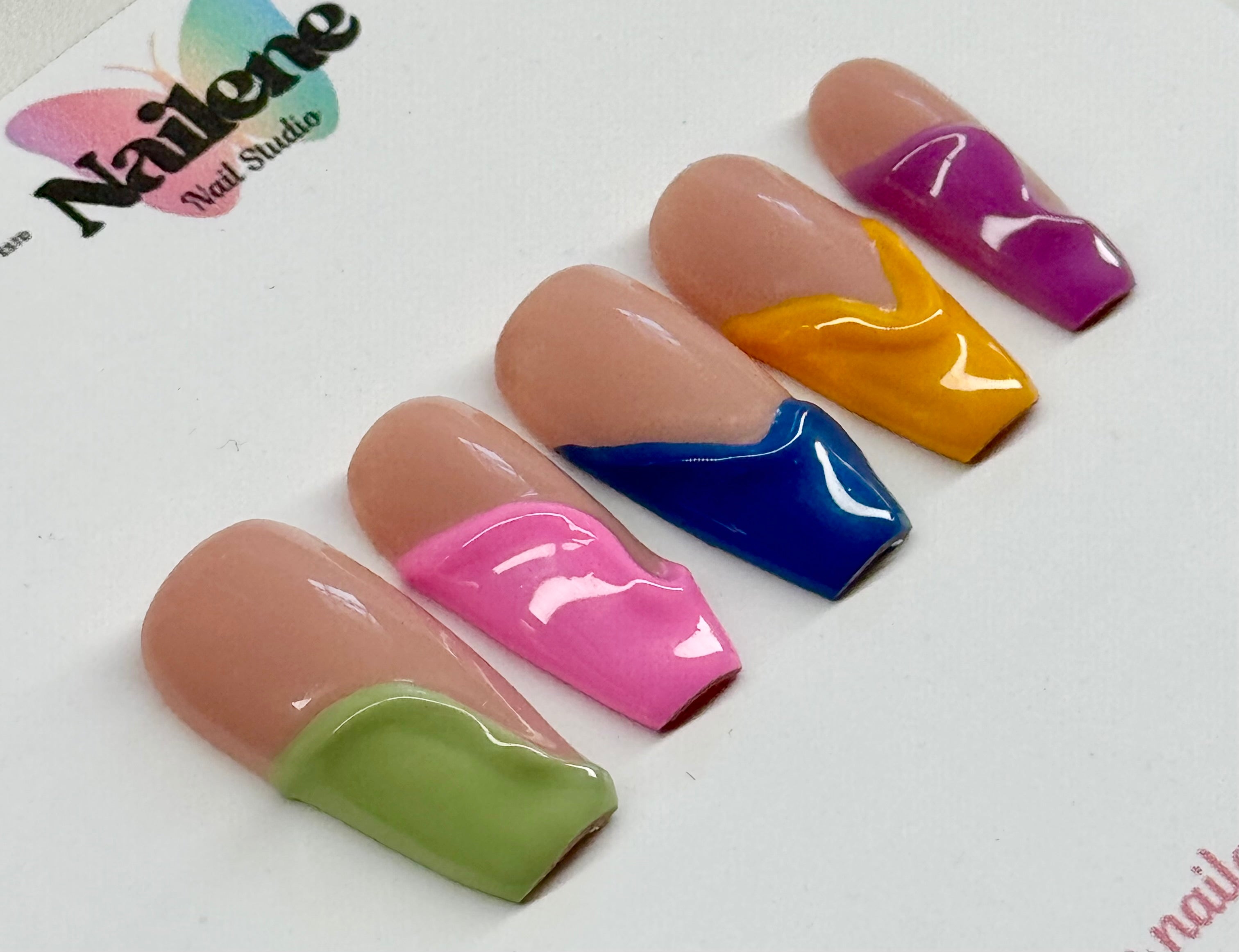 Set of multicolored nail art designs on a white background with 'Nailene Nail Studio' branding.