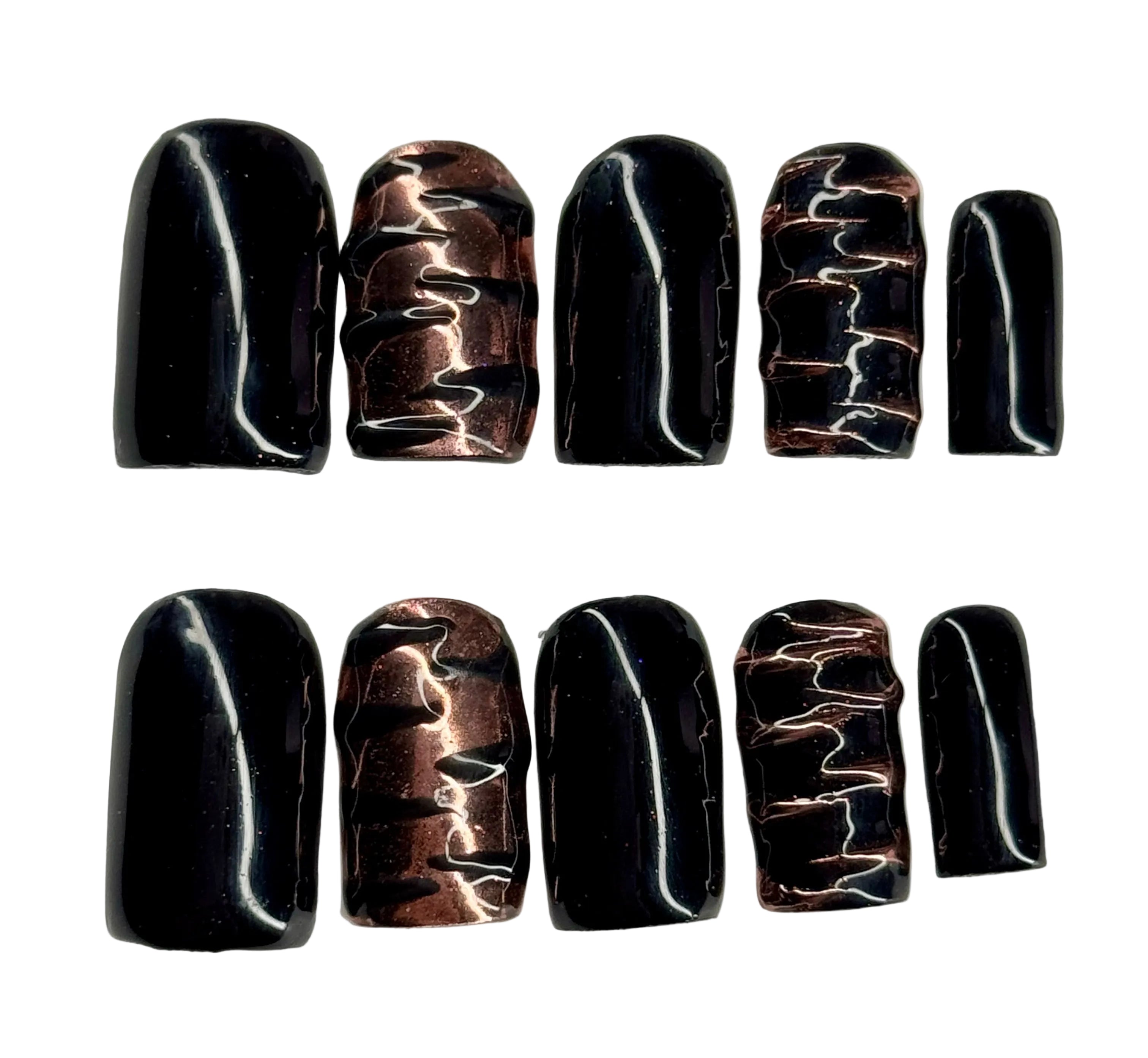Set of black and bronze marbled nail art designs on a white background