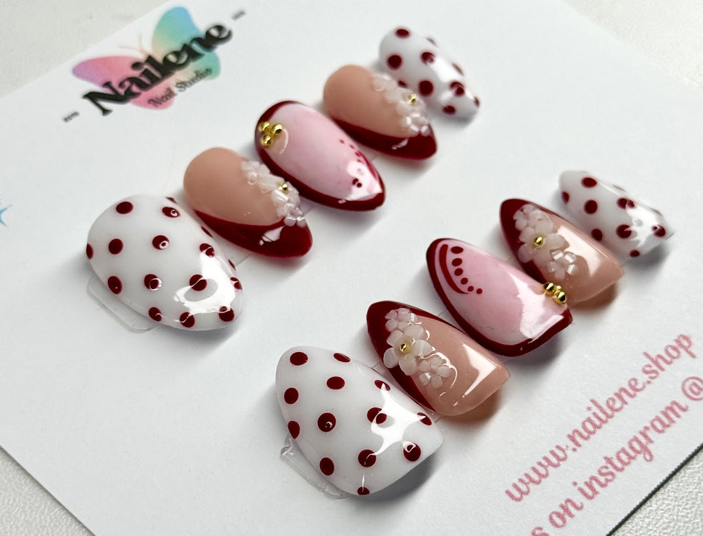 Set of decorative nail art on a white card with 'Nailene' branding.