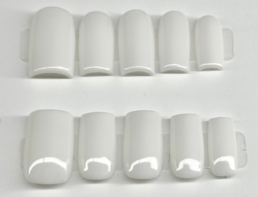 Set of white nail tips on a white background