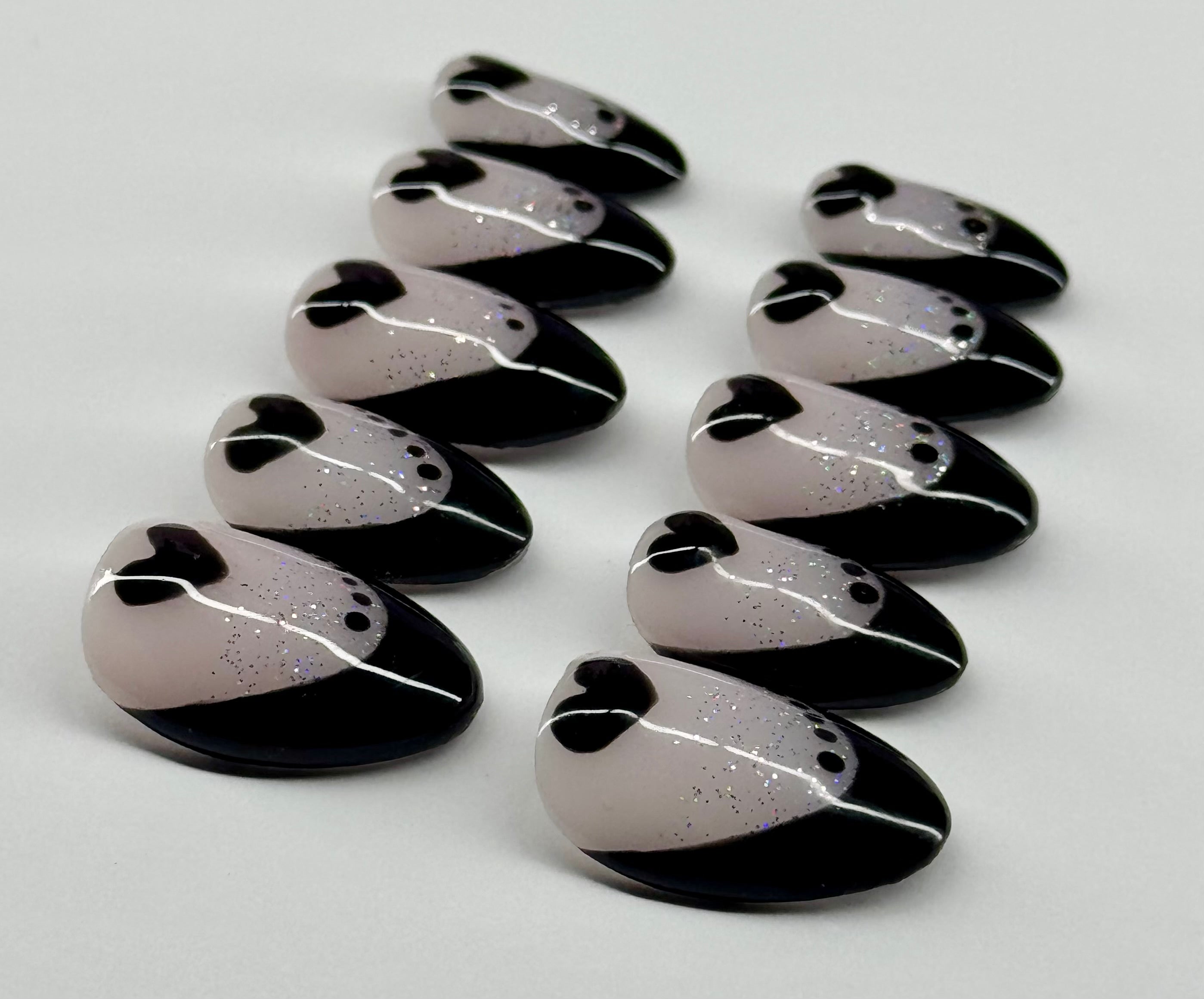 Set of black and white decorative items on a light gray background