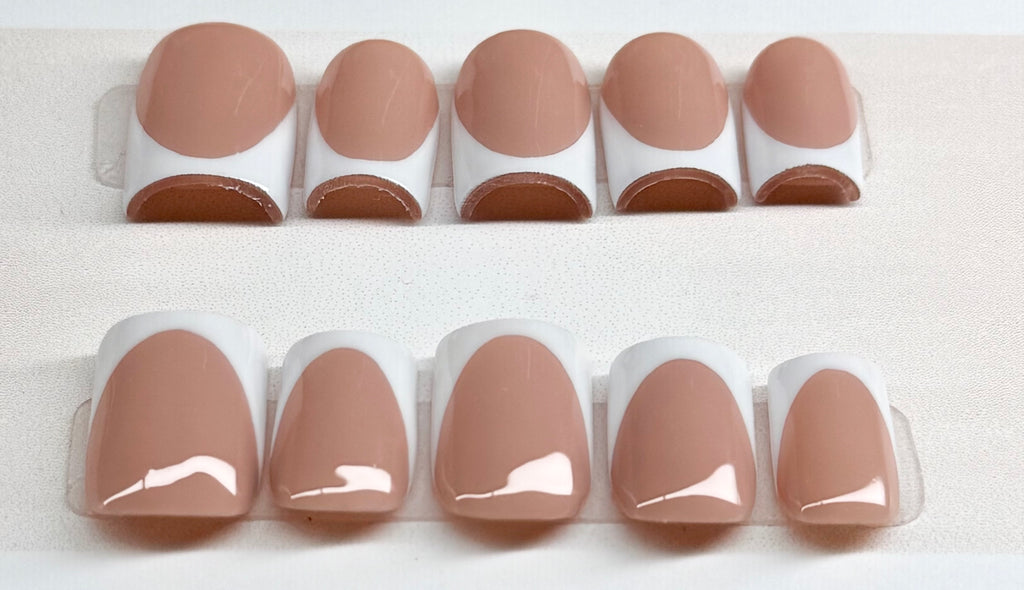 Set of nude base nail polish with white french tips 