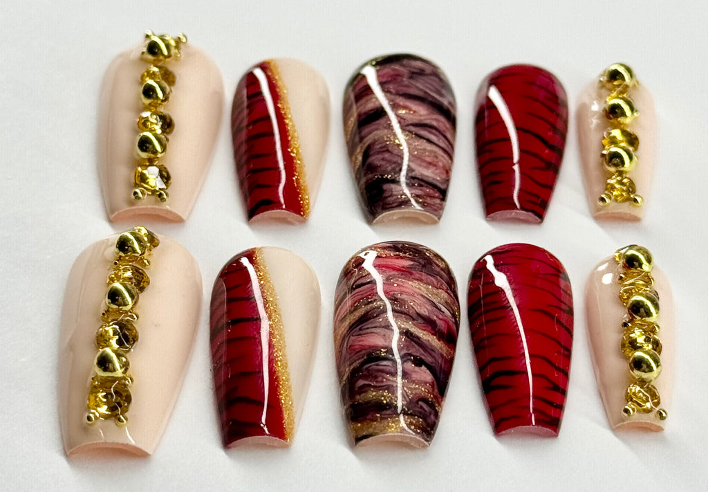 Set of nail art designs with gold accents on a white background