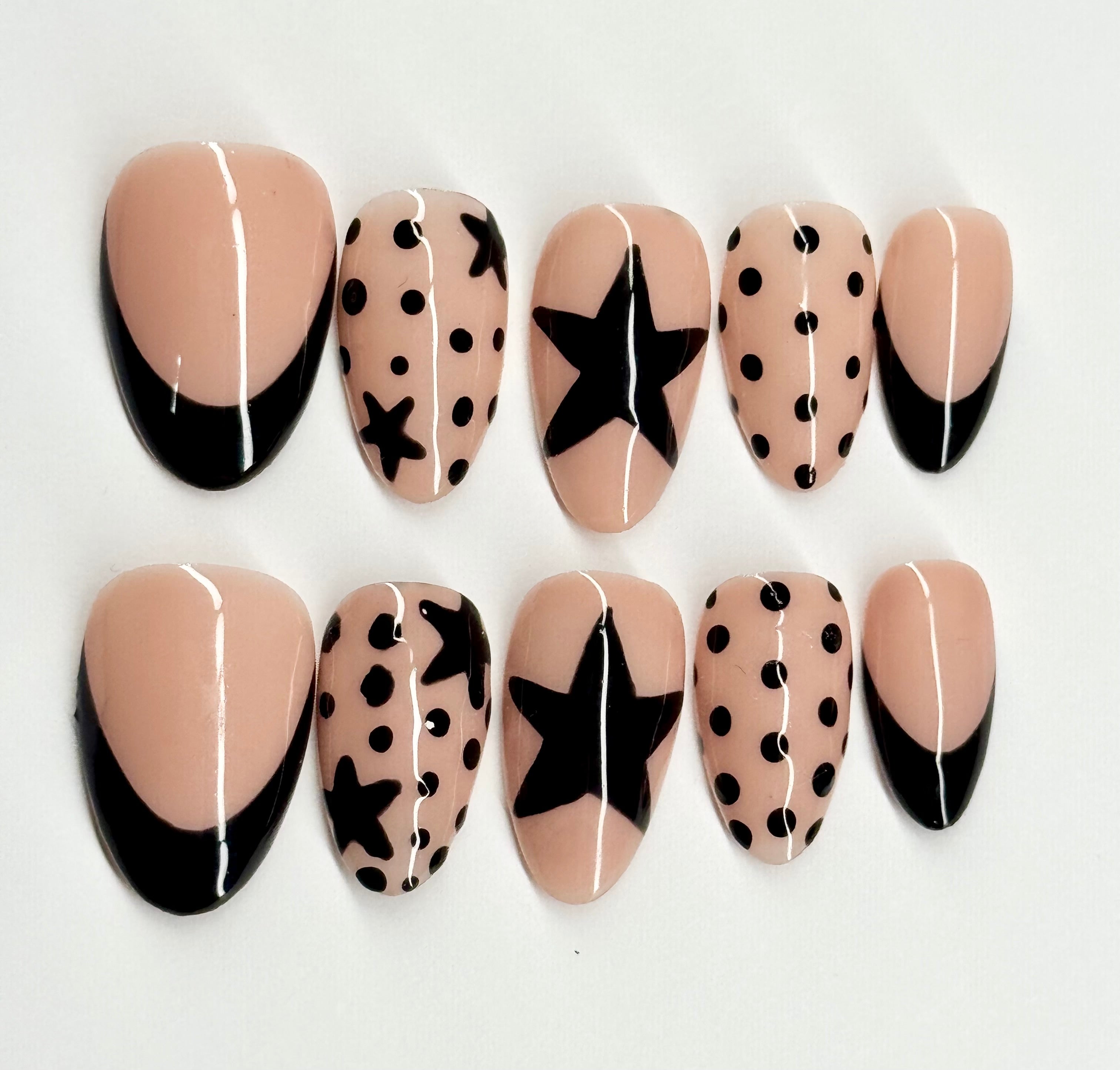 Set of nail art designs with beige, black, and white patterns on a white background