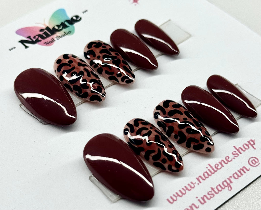 Set of brown and leopard print press-on nails on a white background with Nailene branding.