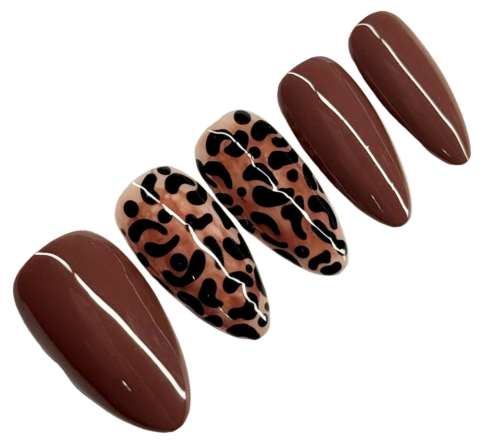 Set of brown and black patterned nail art on a white background