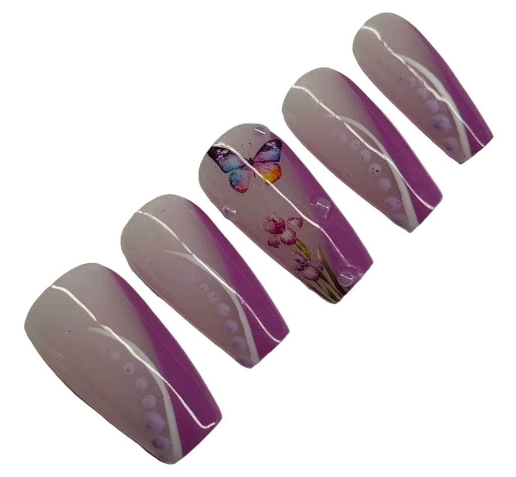 Set of artificial nails with purple accents on a white background