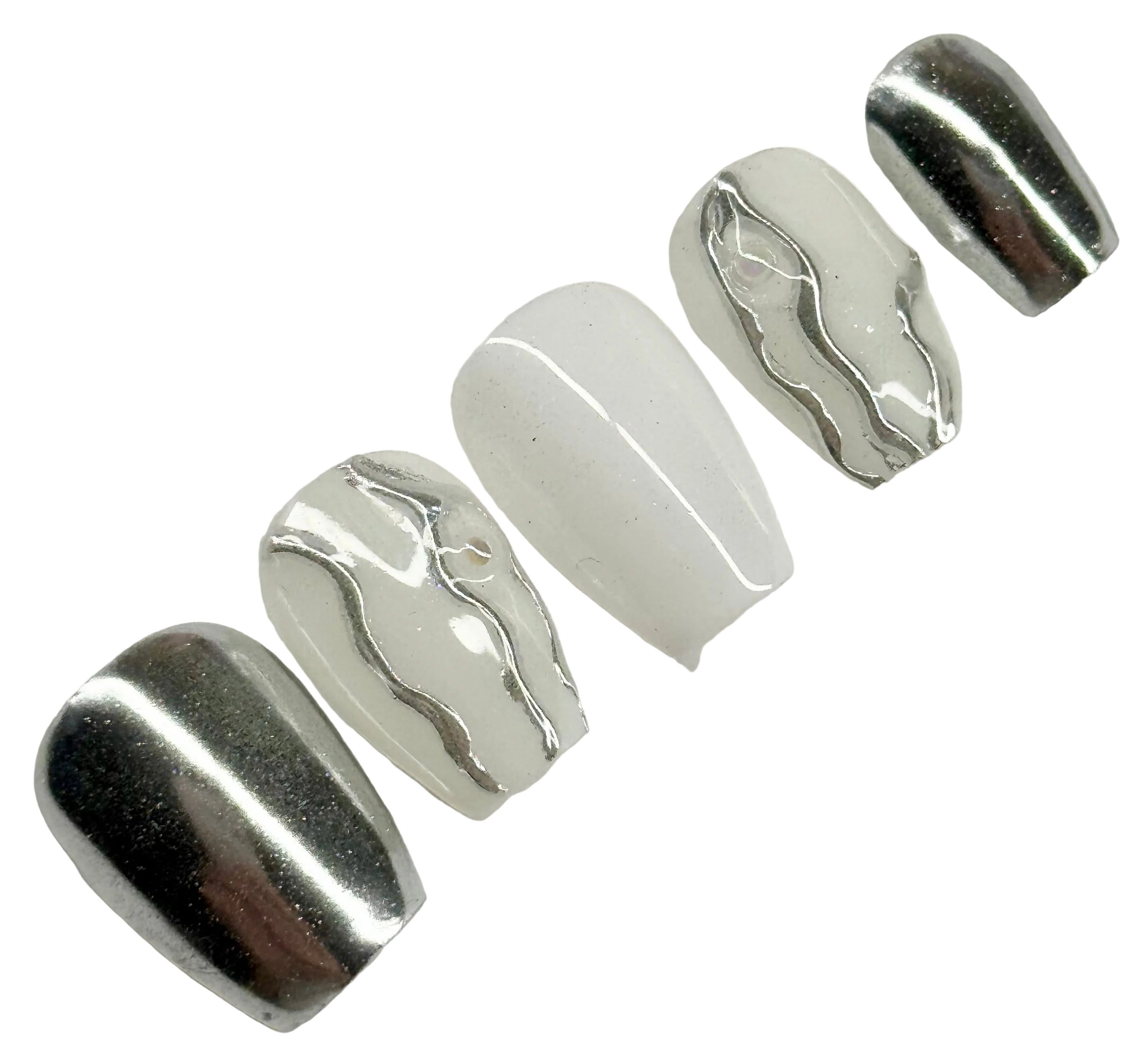 Set of metallic silver nail art extensions on a light gray background