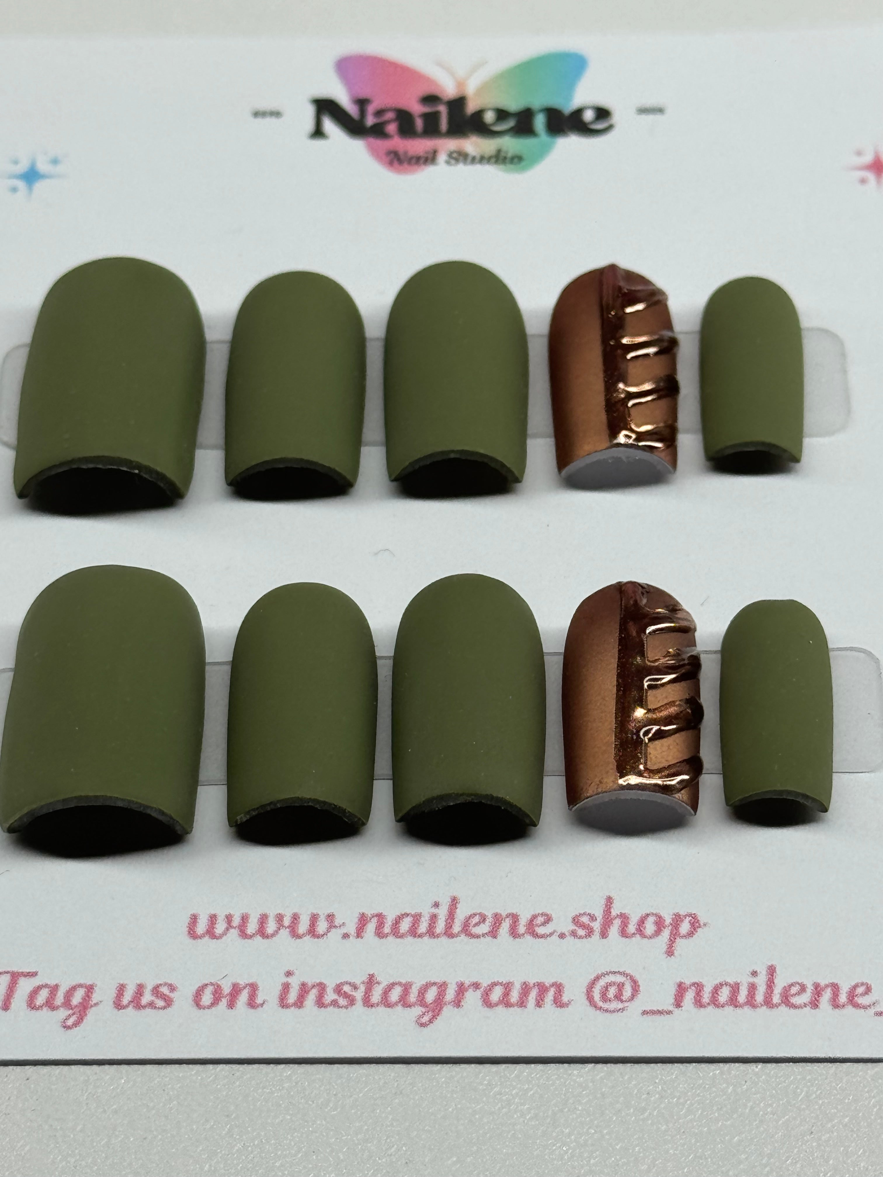 Set of green nail tips on a Nailene branded card