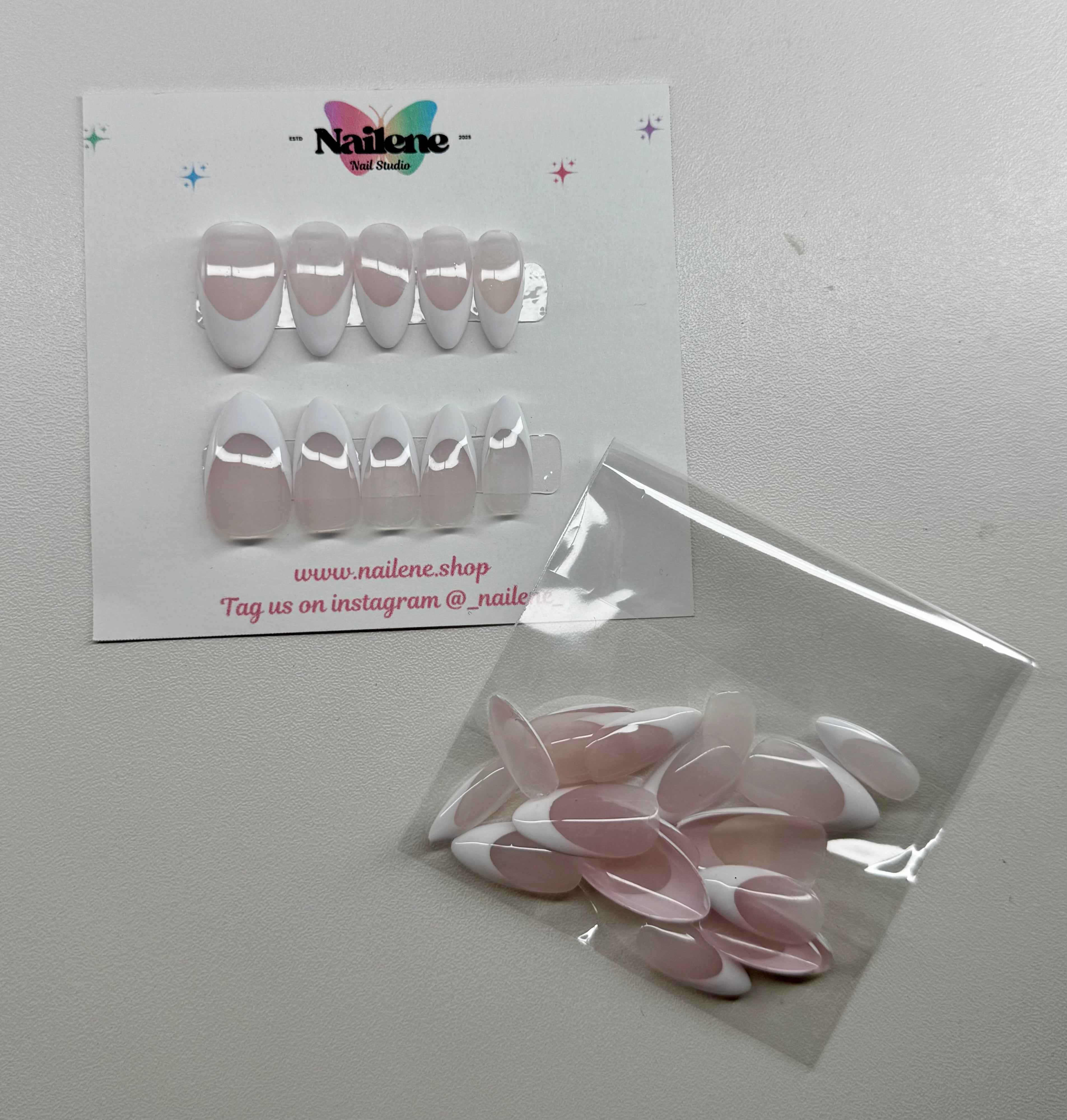 Packaged nail art tips with a visible brand label on a plain background
