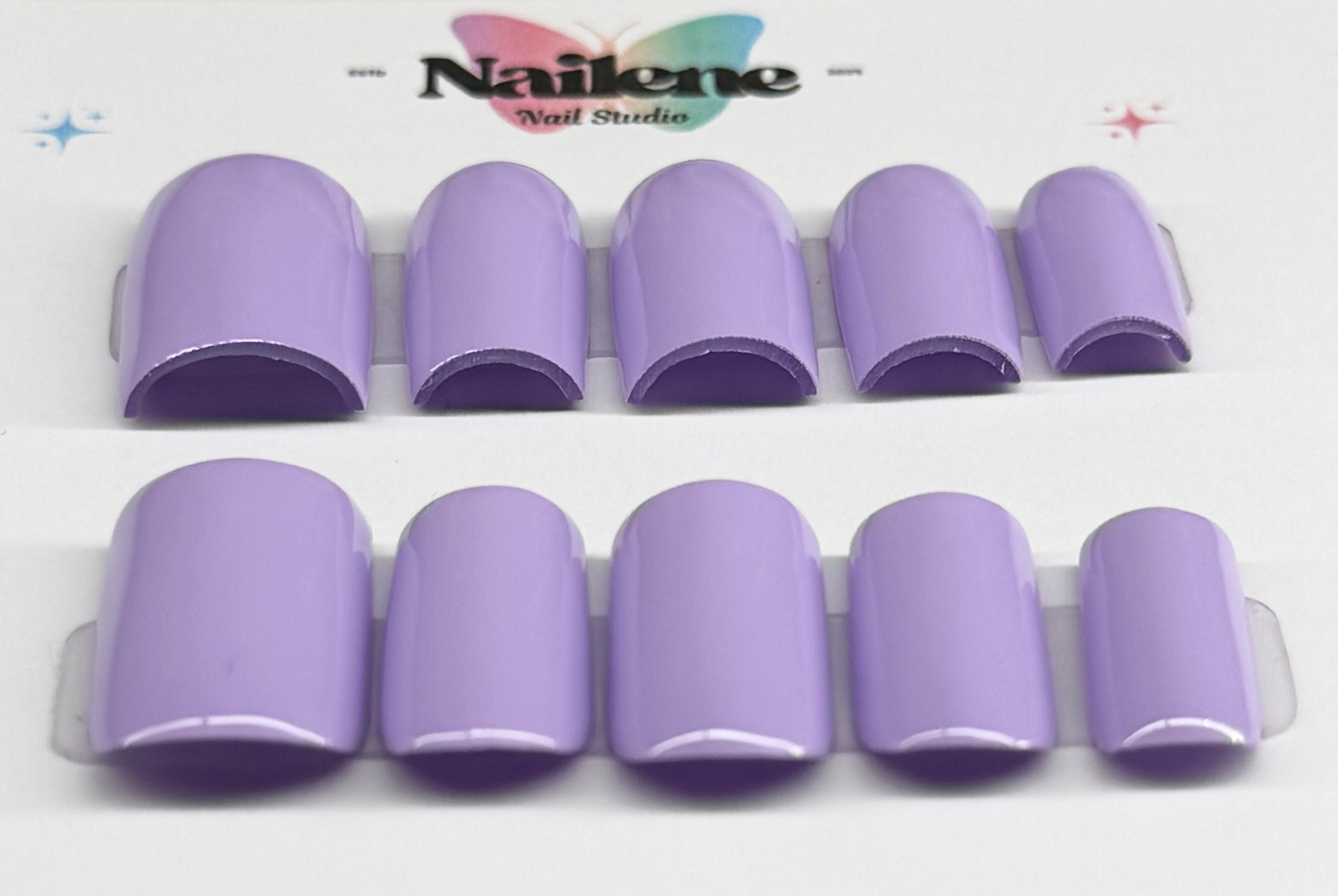 Purple nail tips with 'Nailene' branding on a white background