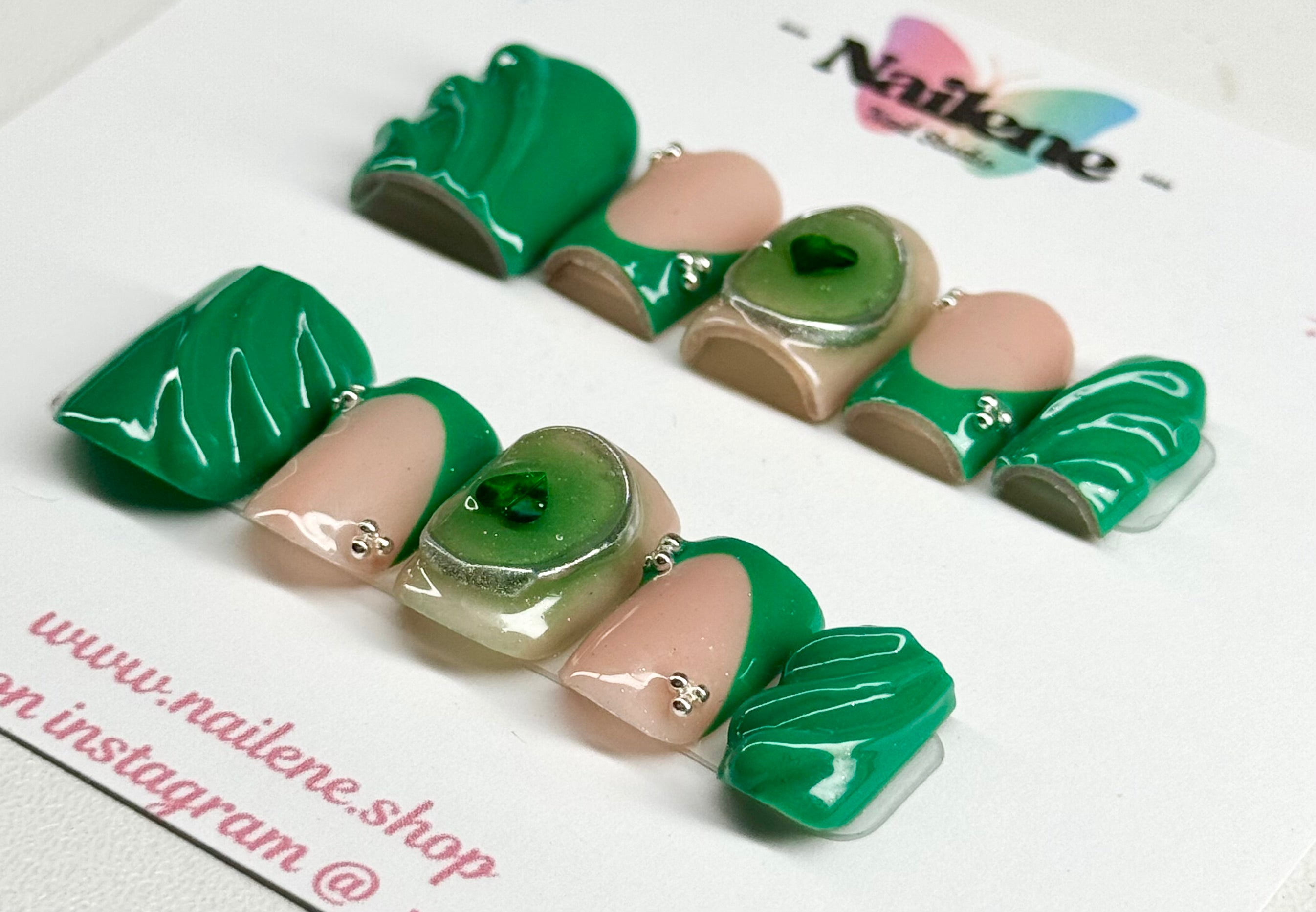 Green and beige nail extensions on a white background with 'Nailene' branding.