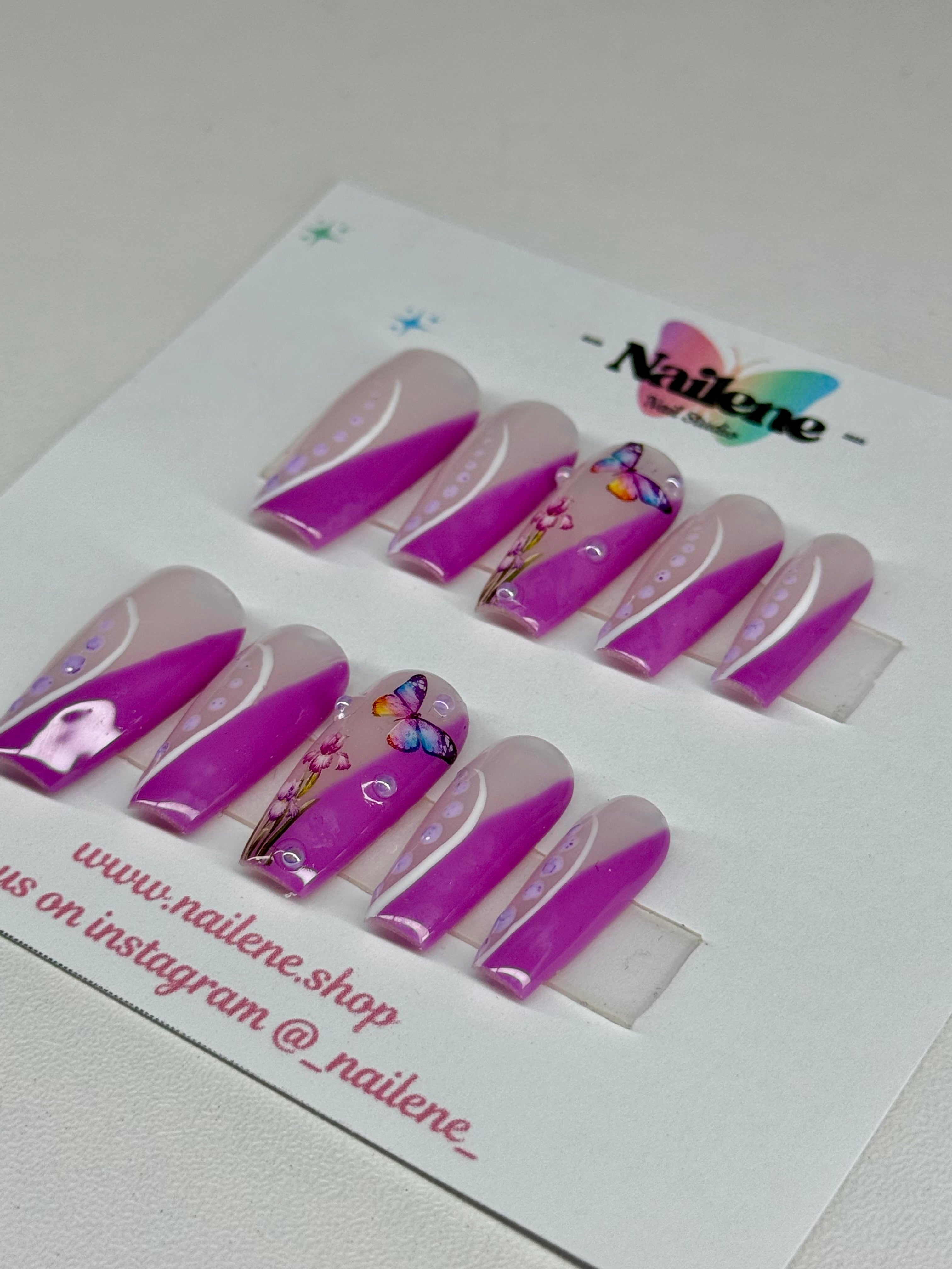 Set of purple and white nail art designs on a white card with Nailene branding.