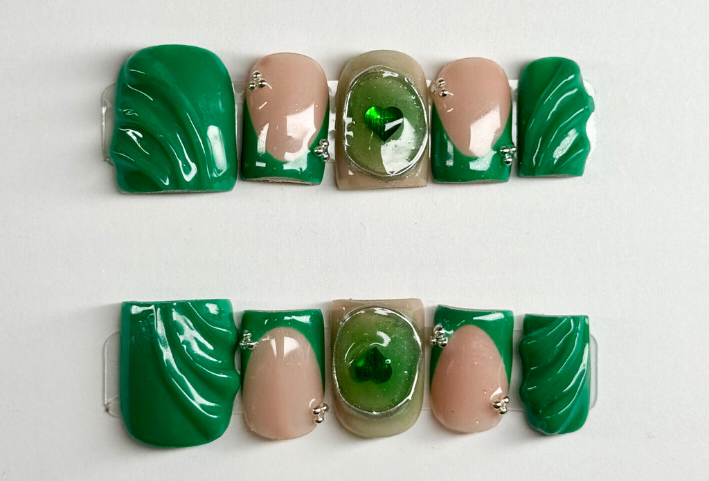 Set of green and beige nail art designs on a white background