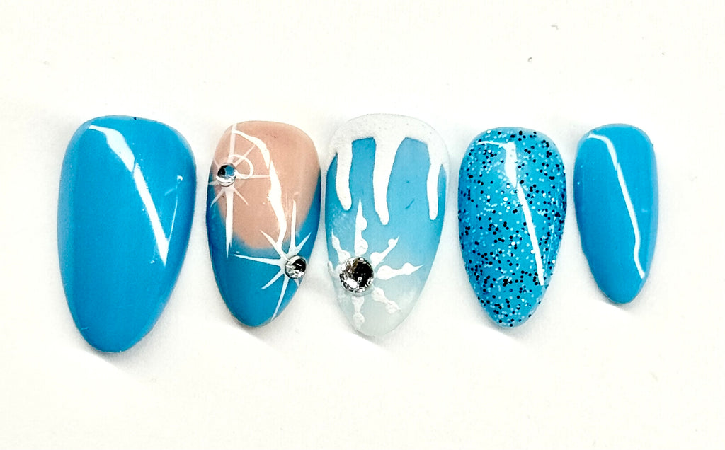 Set of five blue and white nail art designs on a white background