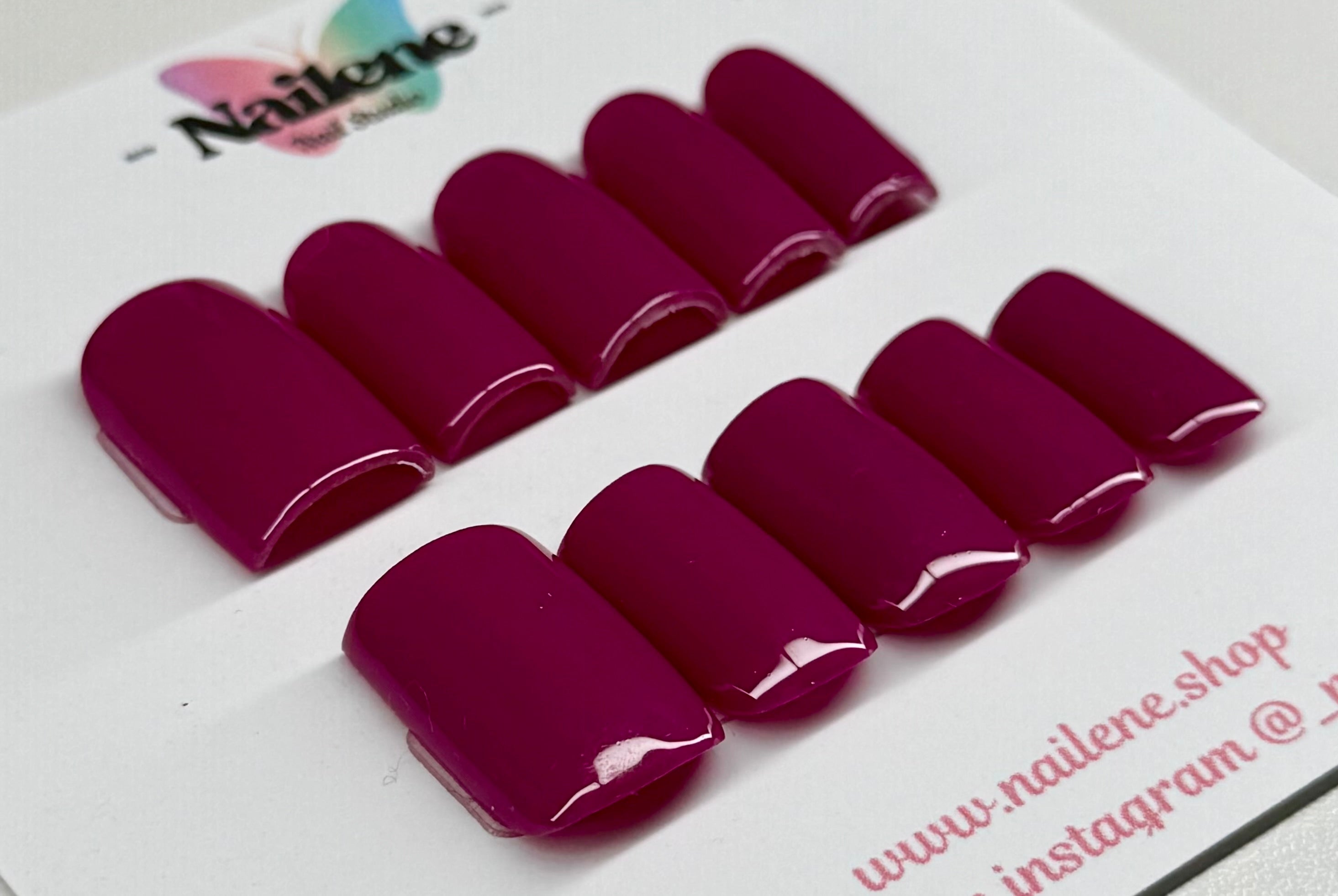 Set of purple plum nail polish samples on a white background with 'Nailene' branding.