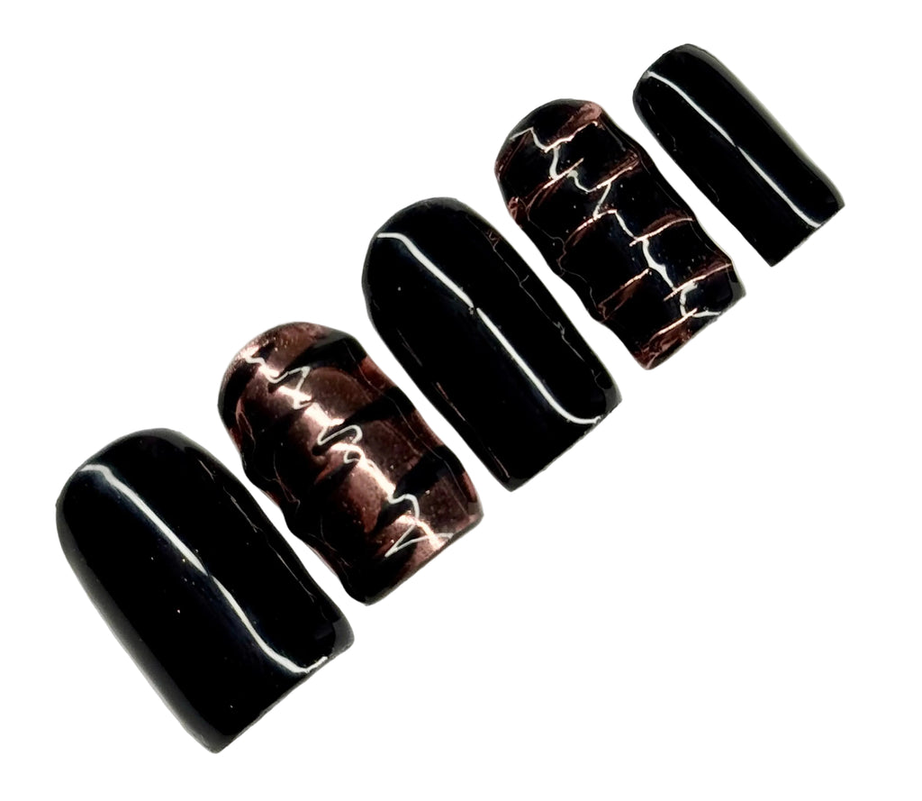 Black marbled nail art design on a white background