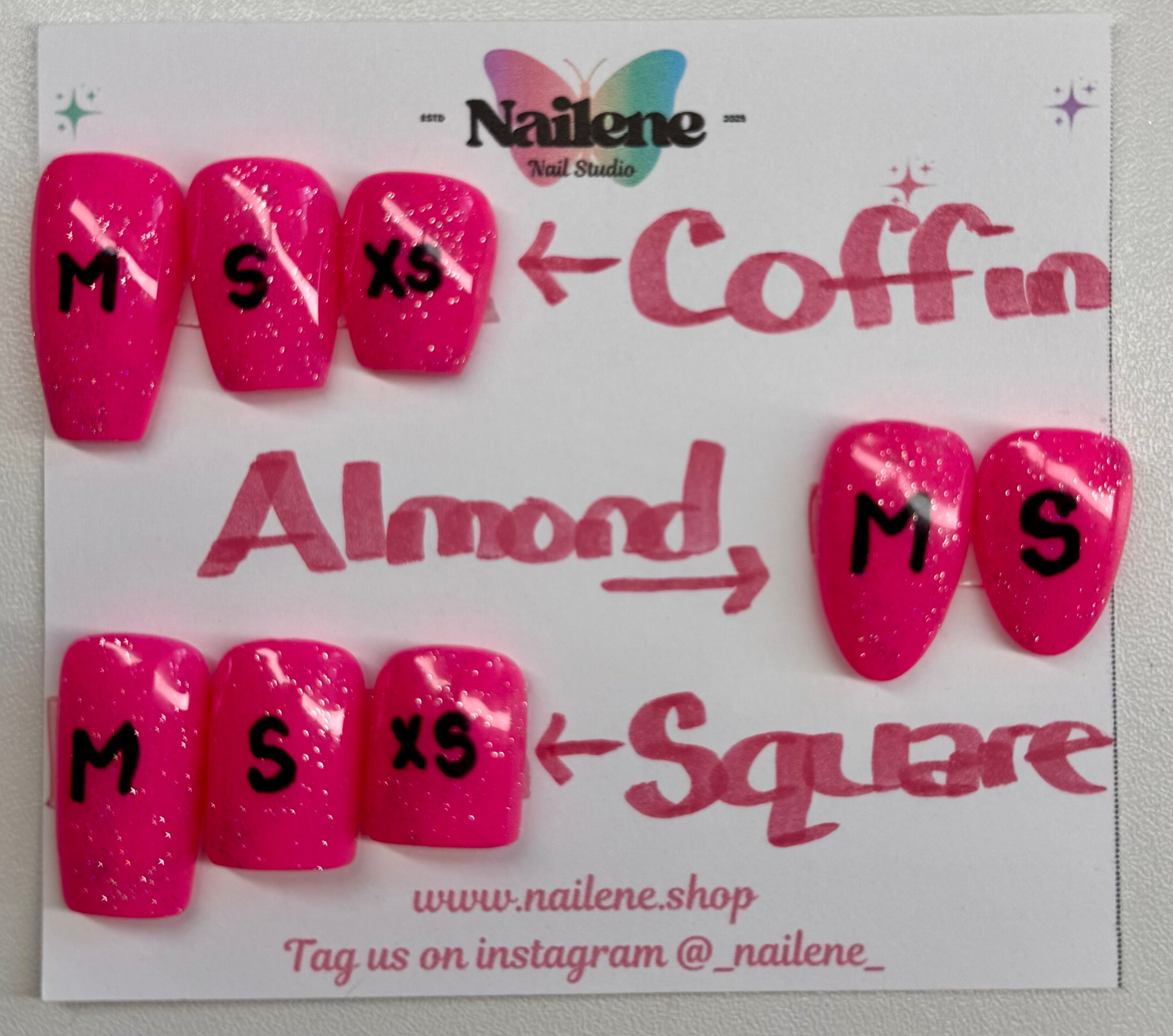 Display card with pink nail tips labeled 'Almond', 'Coffin', and 'Square' by Nailene.
