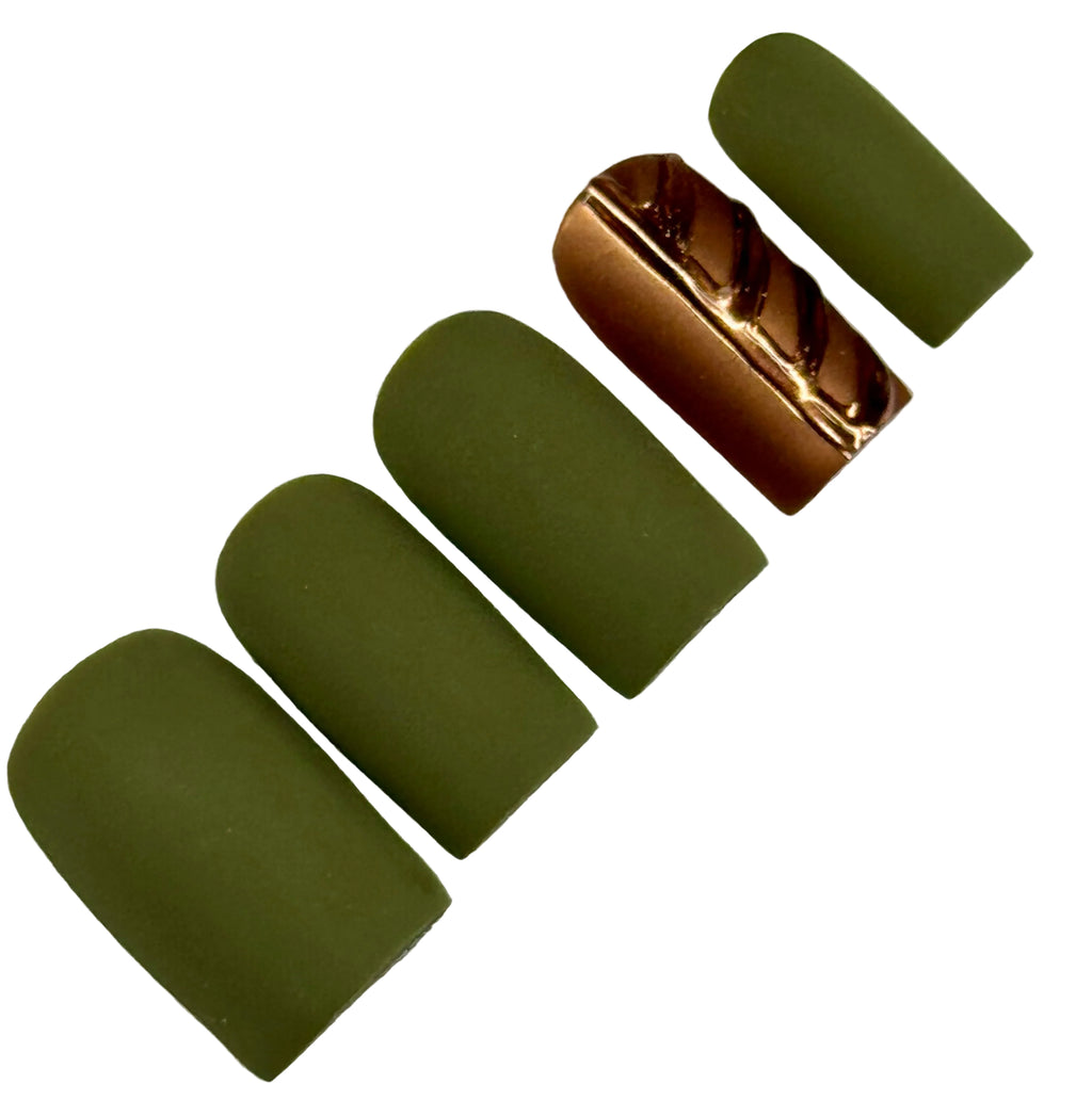 Set of green nail polish with a gold applicator on a light gray background