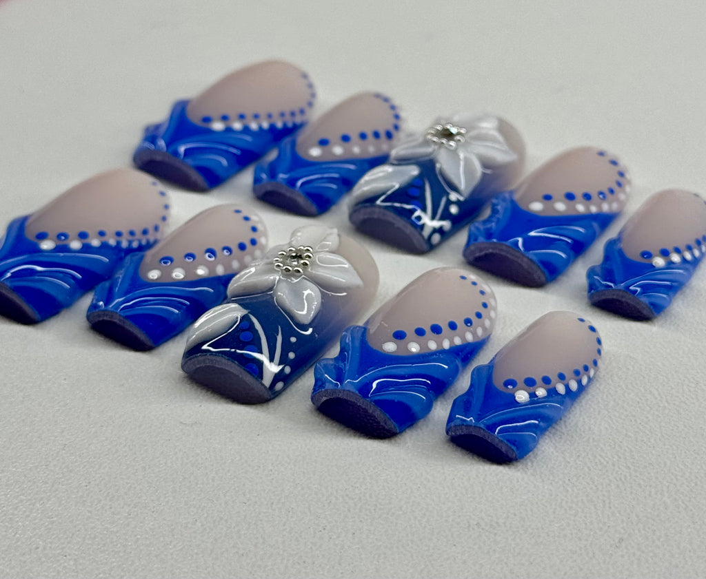 Blue and white decorative items on a gray surface