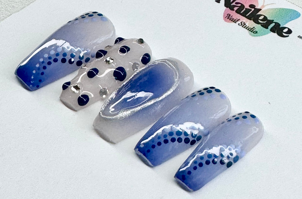 Set of blue and silver nail art designs on a white background with 'Nailene' branding.