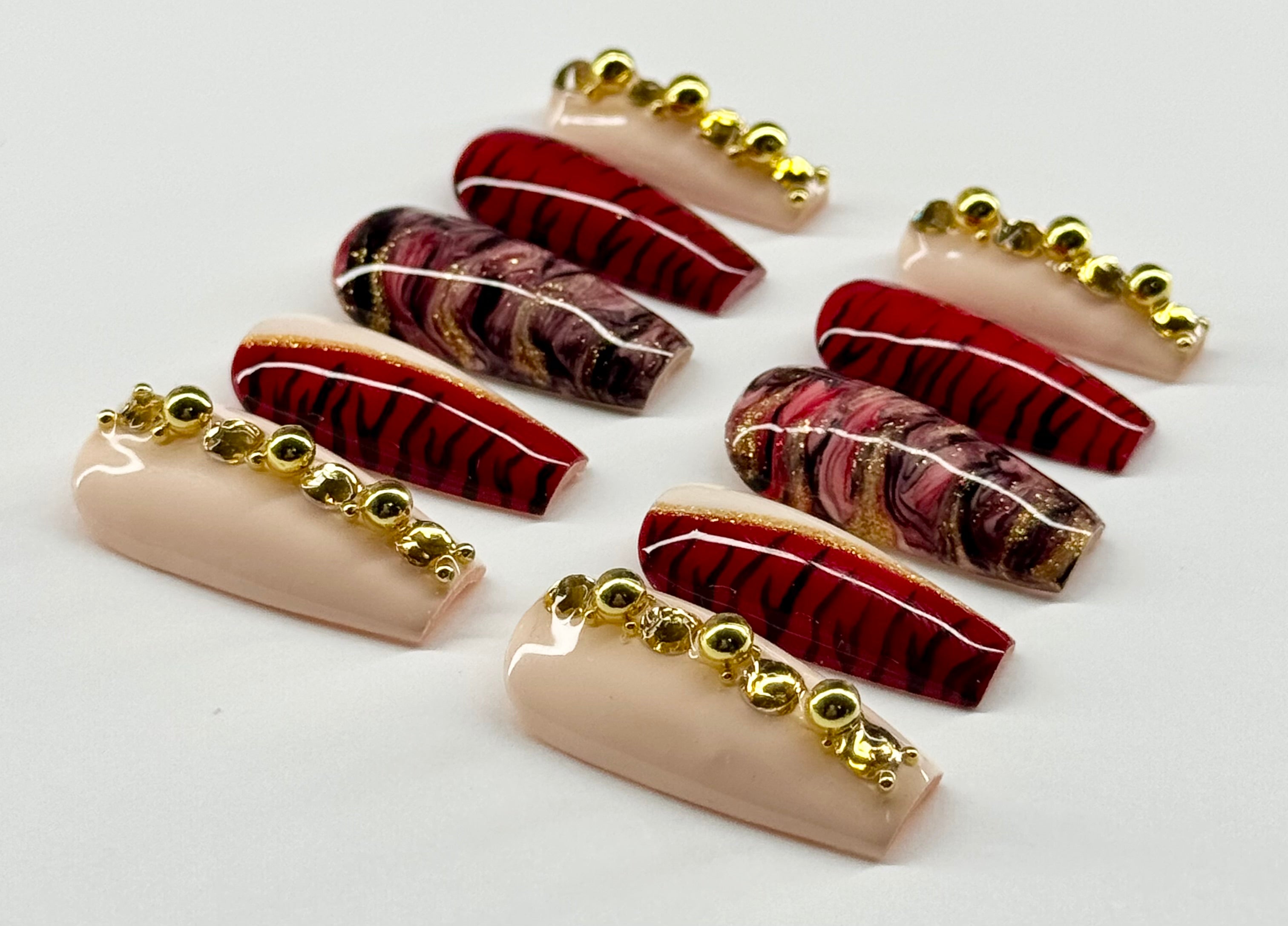 Set of decorative hair combs with gold accents on a white background