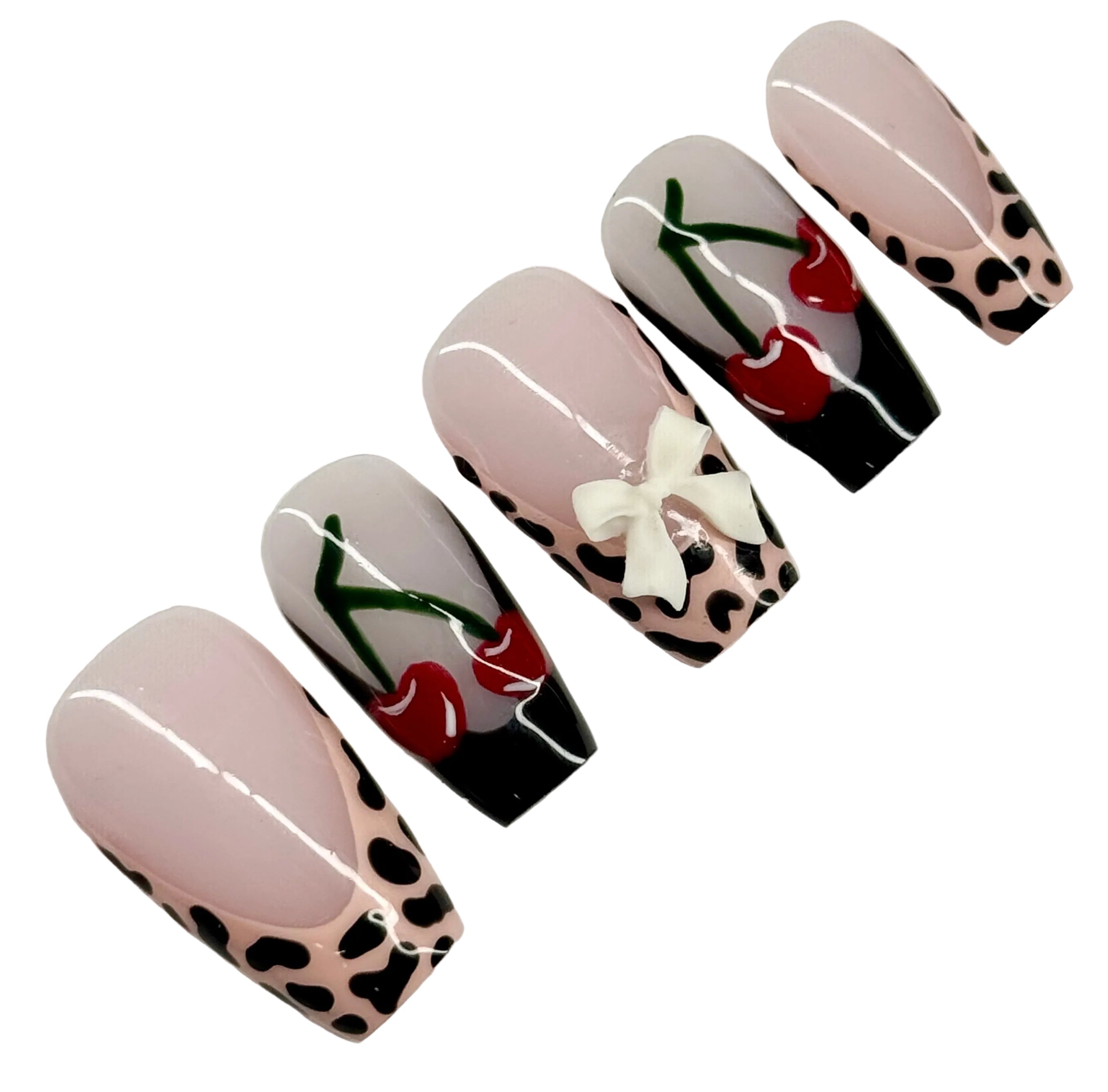 Set of nail art designs with leopard print, cherry, and bow details on a light background