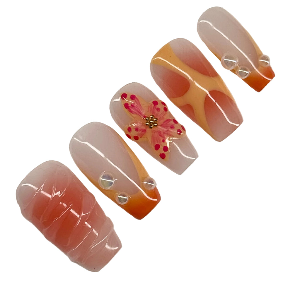 Set of nail art designs with a butterfly and floral pattern on a white background