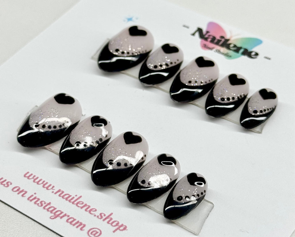 Black and silver nail art tips on a white background with 'Nailene' branding.