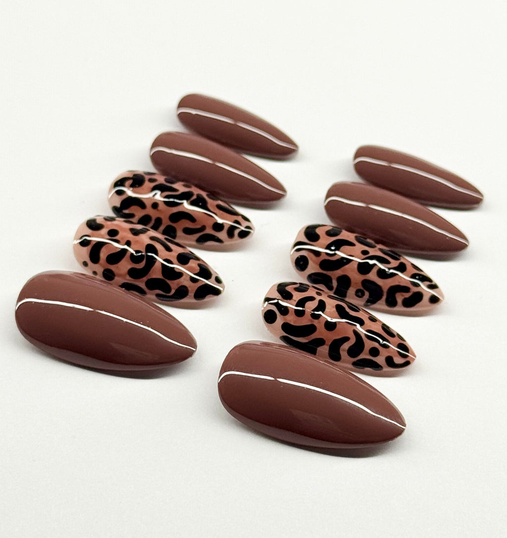 Chocolate candies with leopard print design on a white background