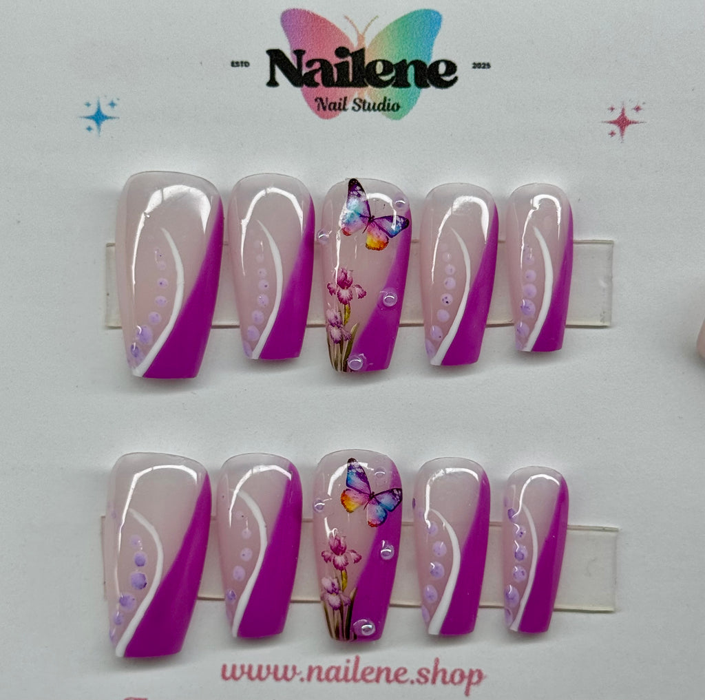 Set of decorative nails with purple and white designs on a white background, featuring the Nailene Nail Studio logo.