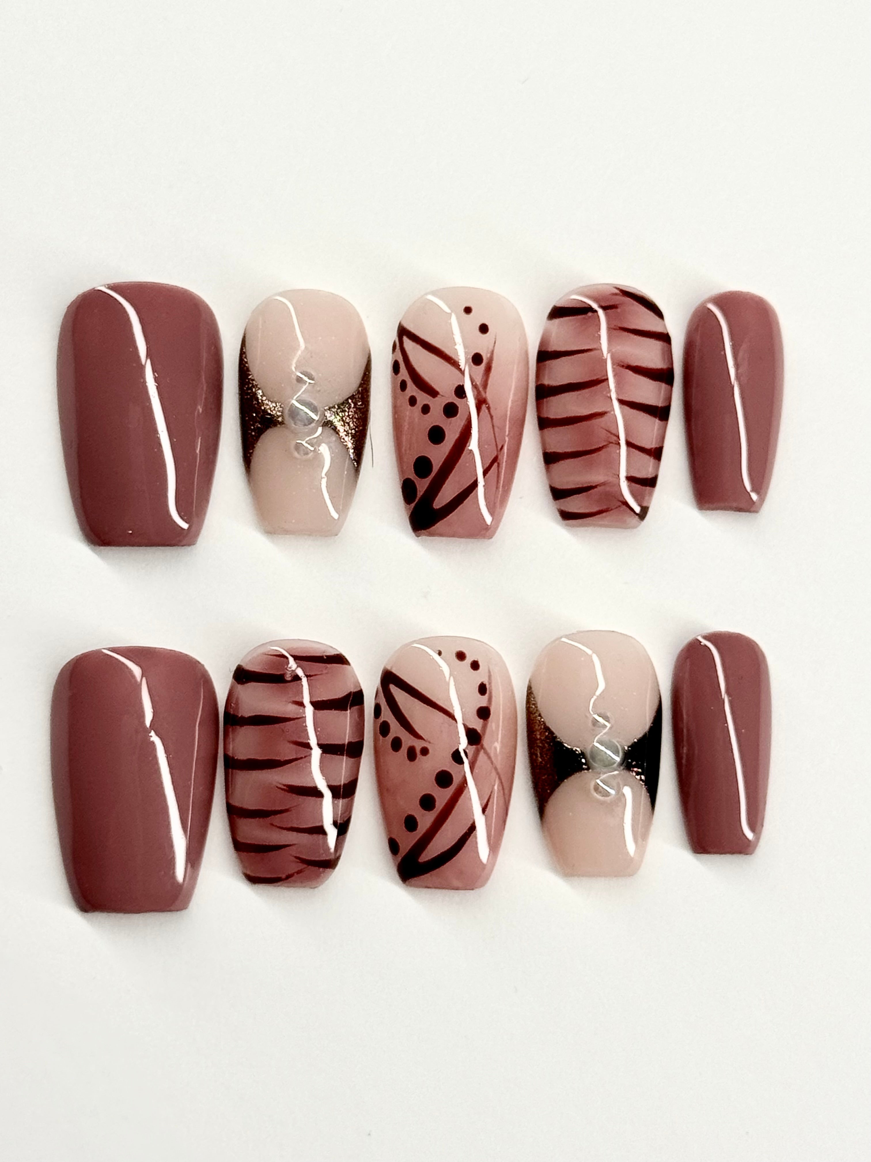 Set of nail designs with brown, beige, and black patterns on a white background