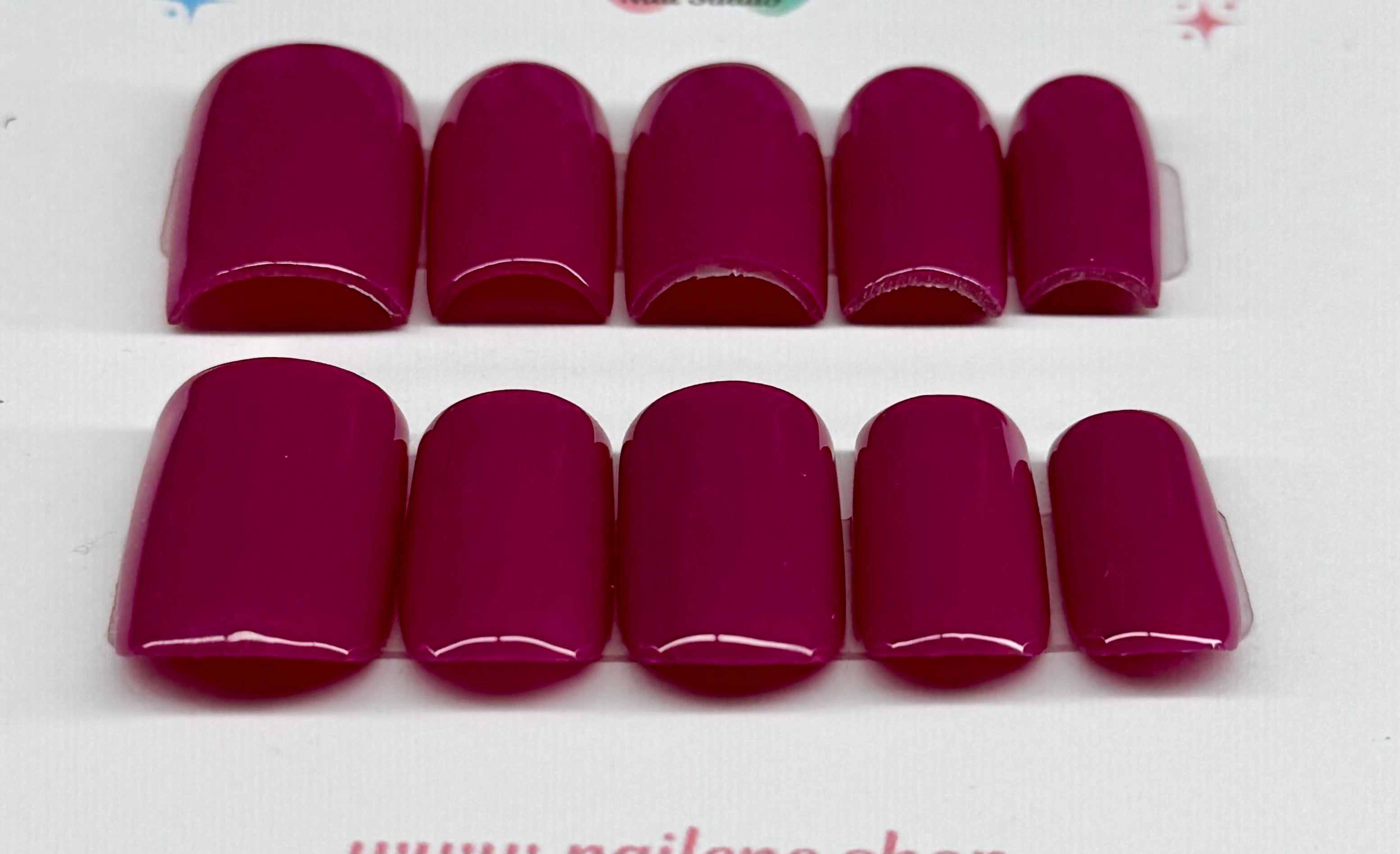 Set of plum solid nail on a white background