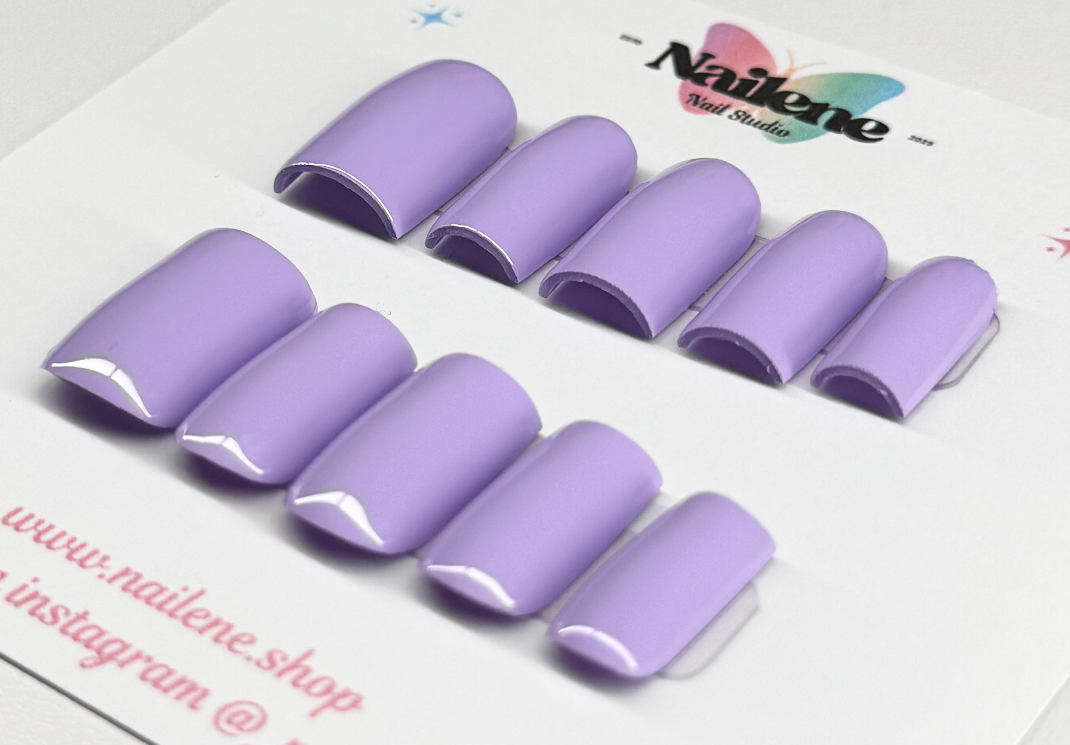 Set of purple nail extensions on a white background with 'Nailene' branding.
