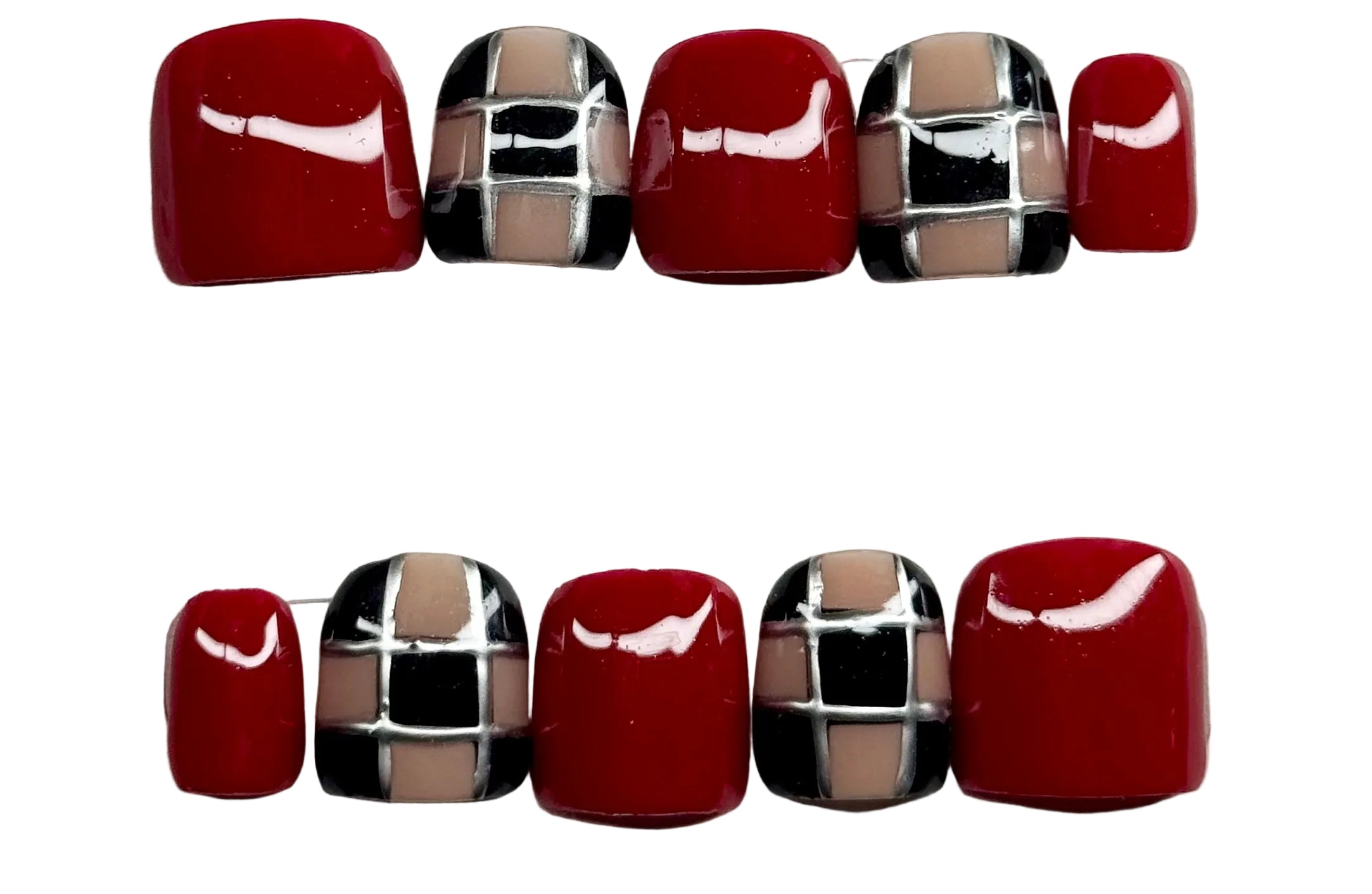 Set of red and silver checkered beads on a white background