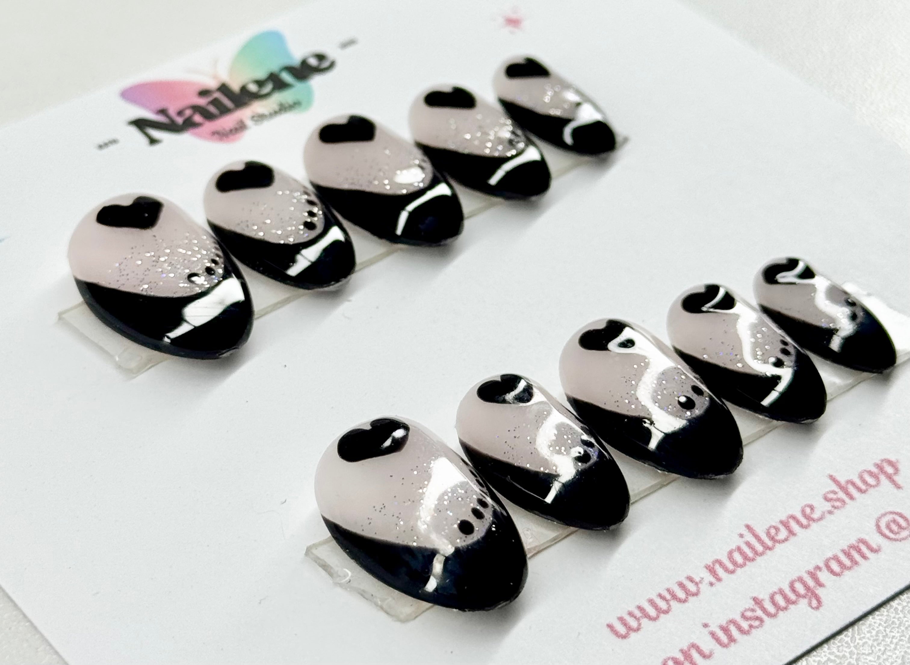 Black and white panda-shaped nail art stickers on a white background with 'Nailene' branding.