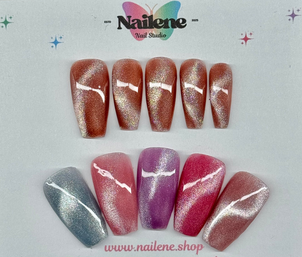 Set of nail designs with glittery finish on a light gray background, featuring the brand 'Nailene'.