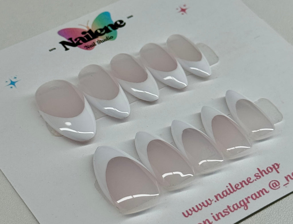 Set of white nail extensions on a branded card with 'Nailene' branding.