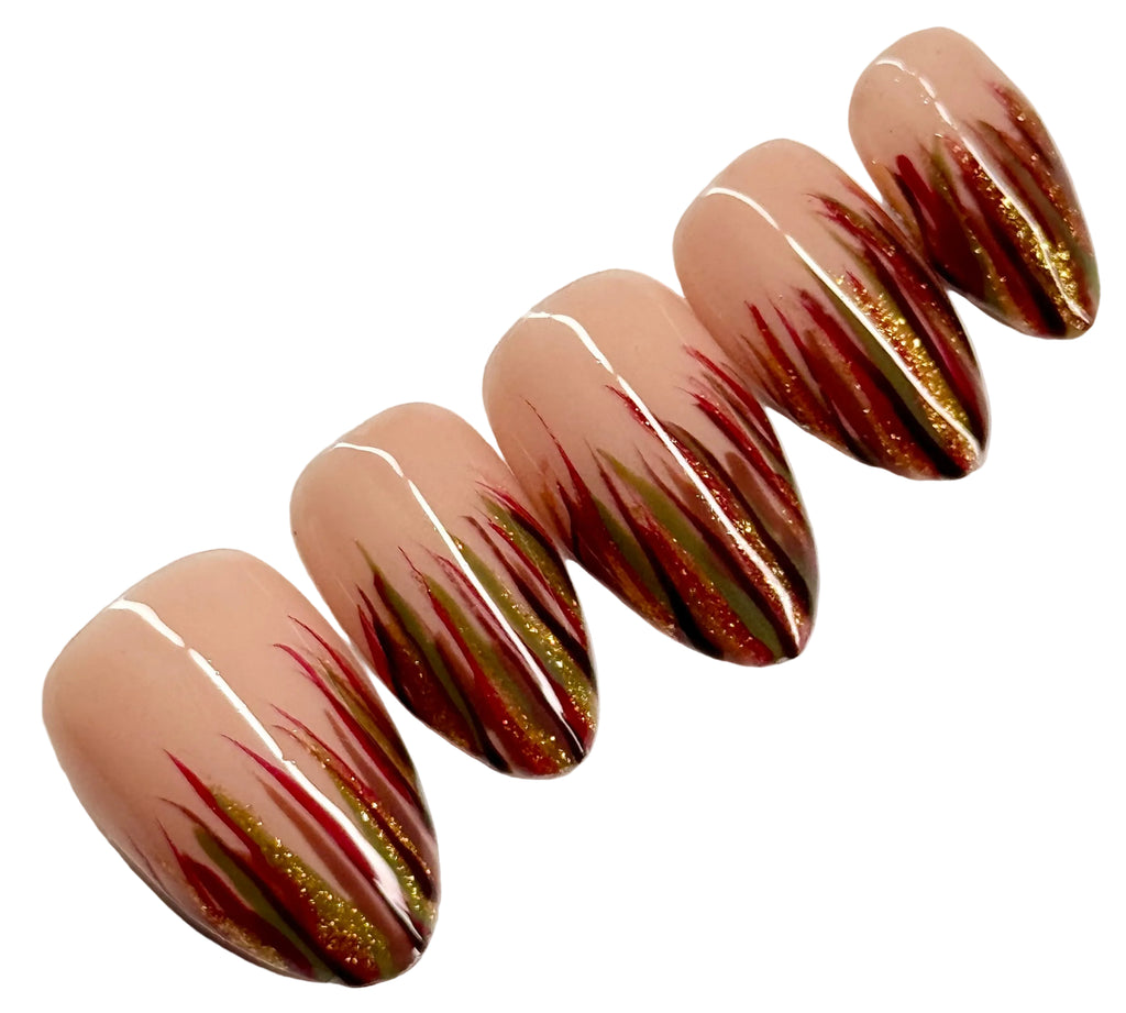 Set of long, almond-shaped nails with a gradient design on a white background