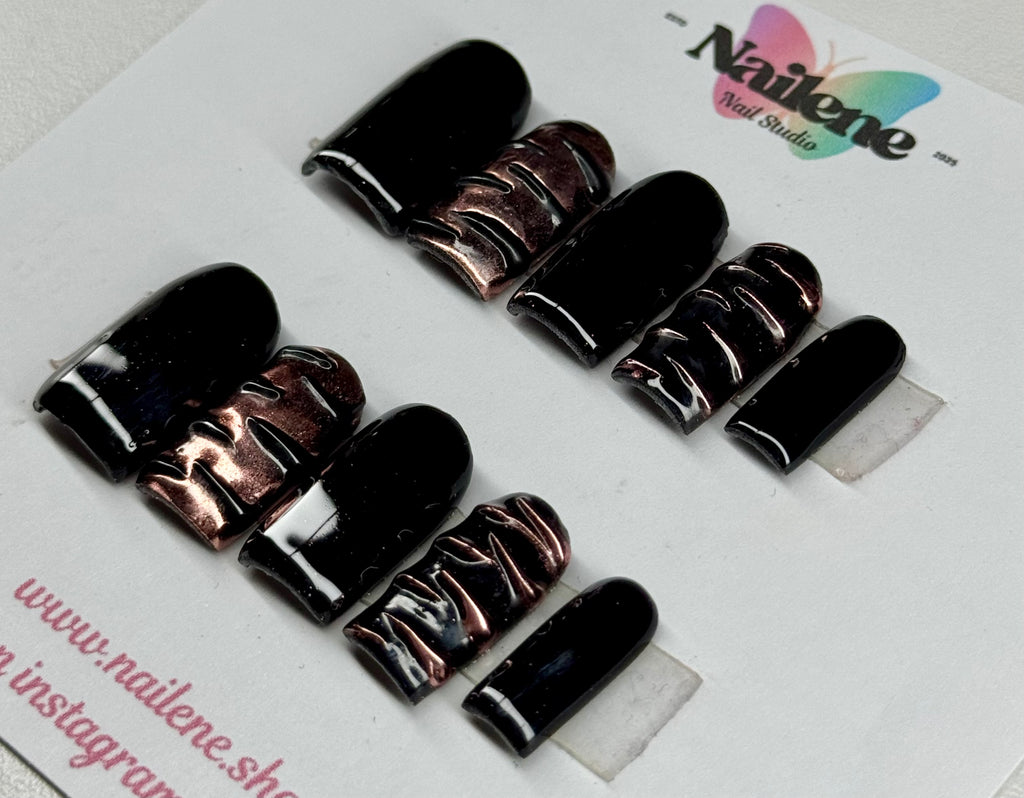 Set of black and rose gold nail polish samples on a white background with 'Nailene' branding.