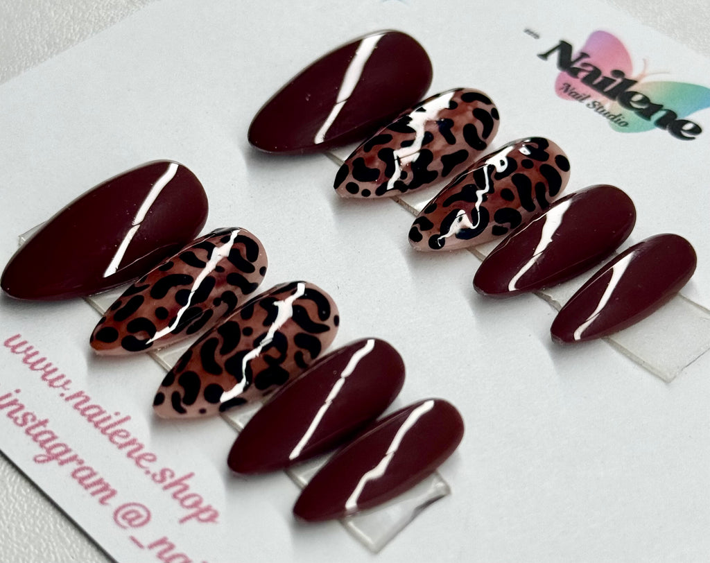 Set of maroon and leopard print nail art designs on a white background with 'Nailene' branding.