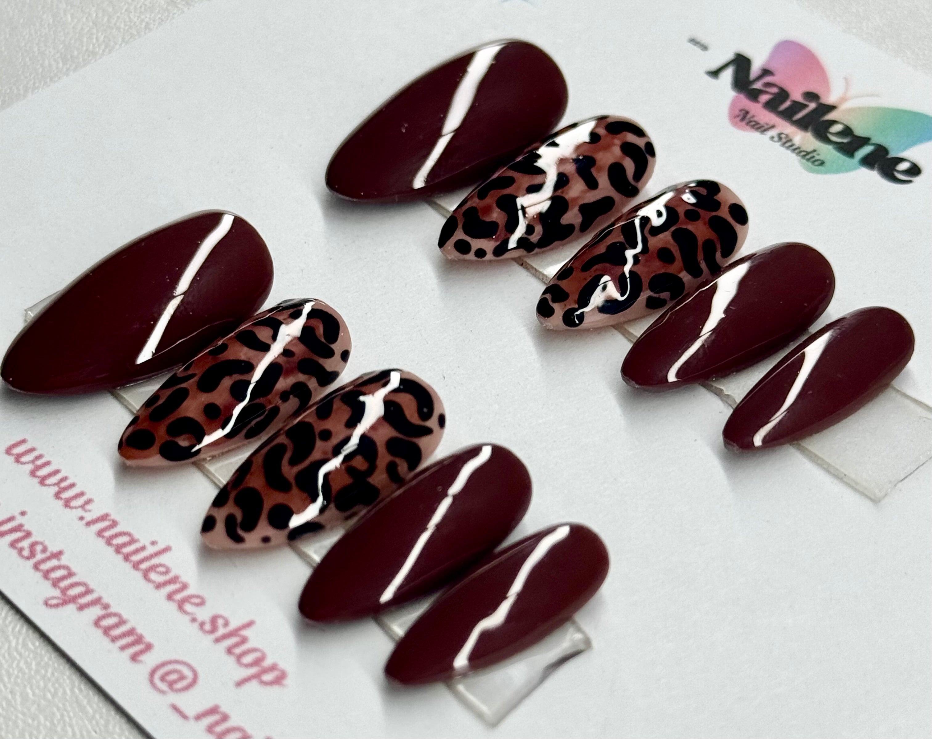 Set of maroon and leopard print nail art designs on a white background with 'Nailene' branding.