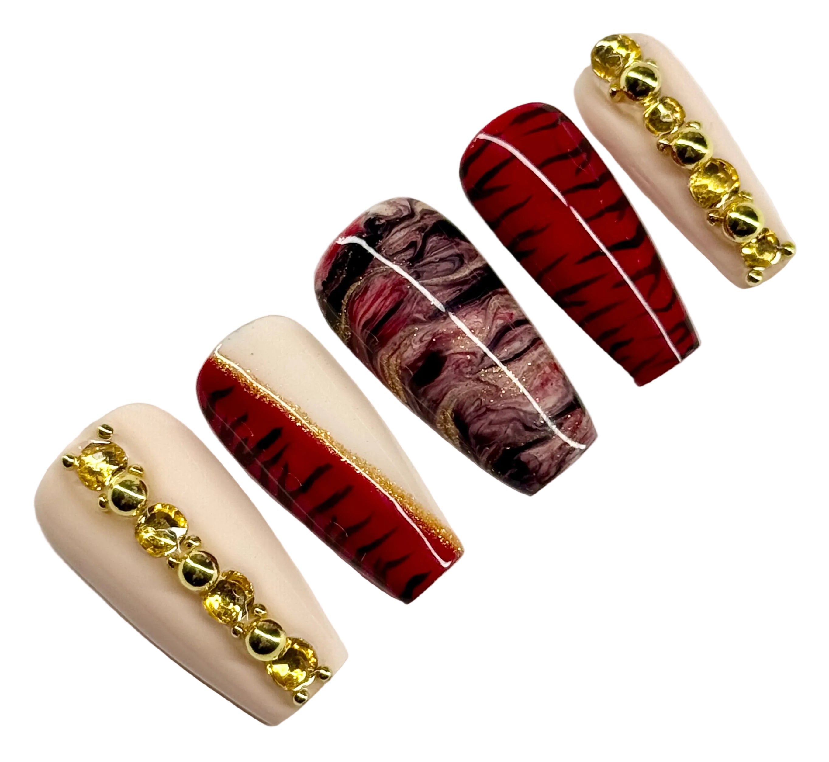 Set of nail art designs with gold accents on a white background