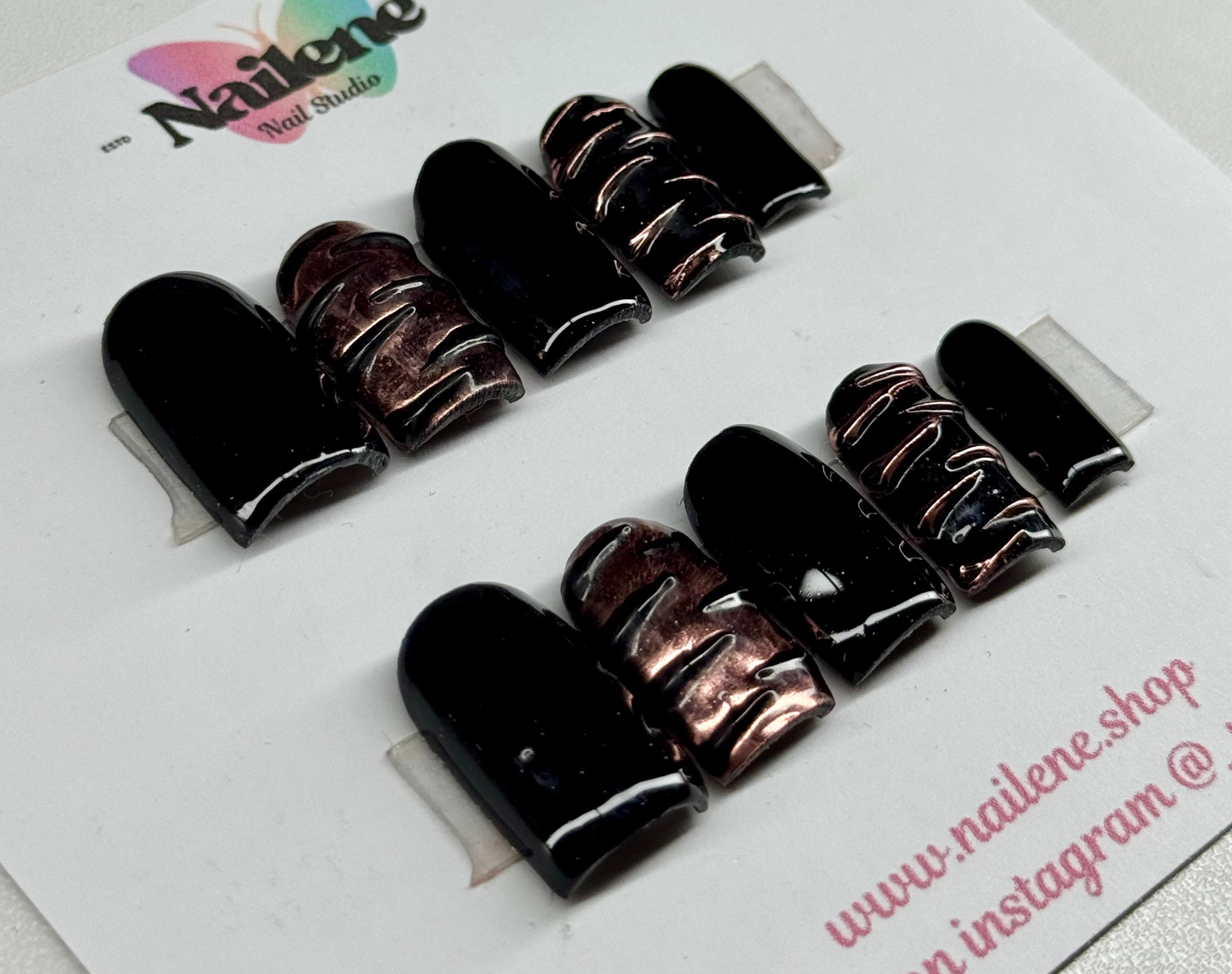 Set of black and brown gradient nail polish bottles on a white background with 'Nailene' branding.