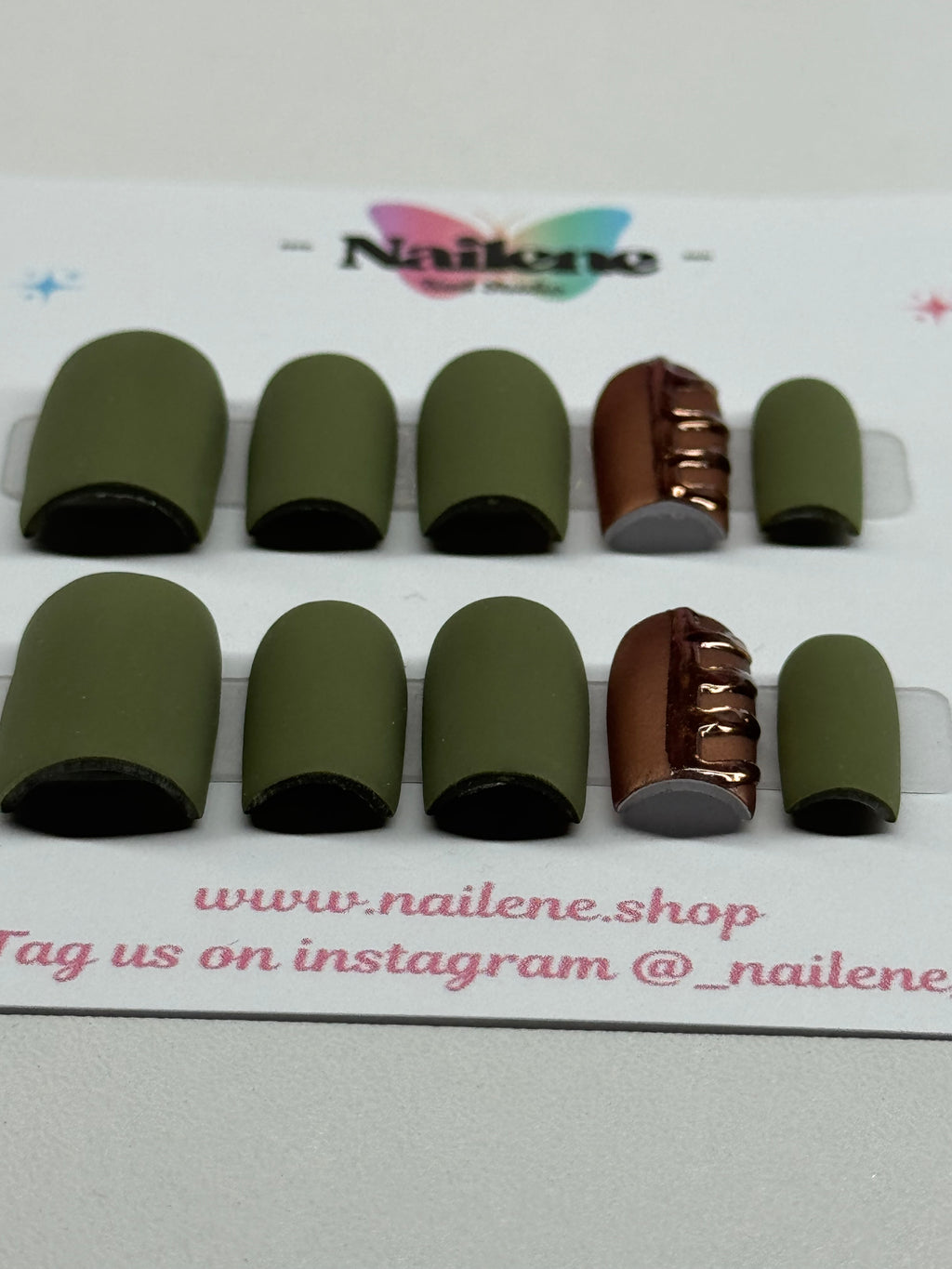 Set of green hair ties on a white background with brand name and social media information.