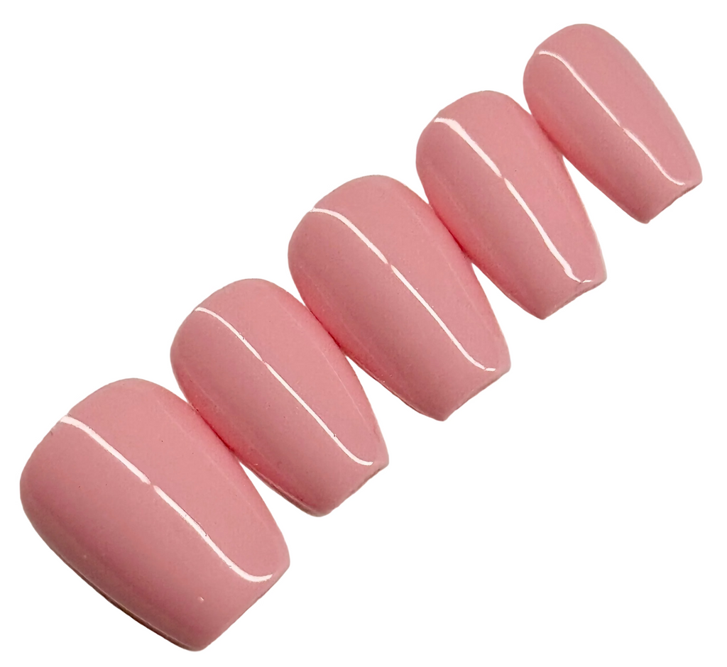 Set of pink nail extensions on a white background