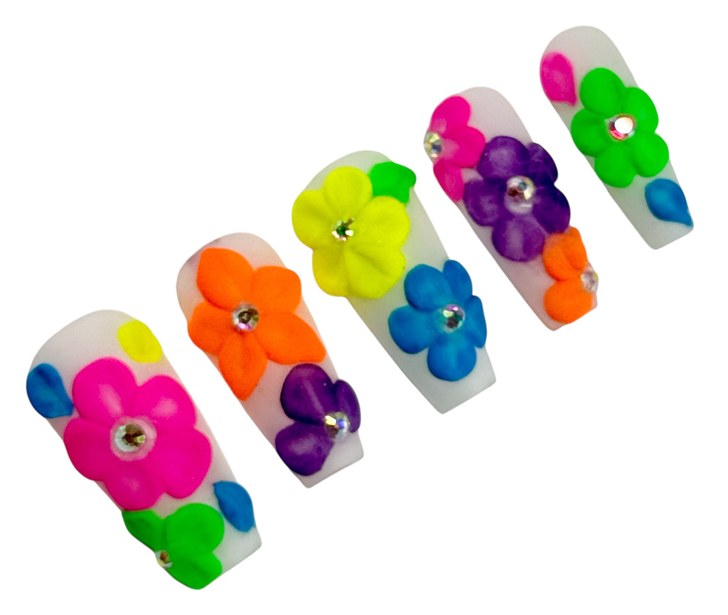 Colorful flower-shaped clips on a white background